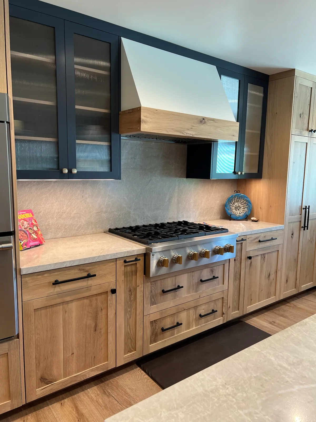 Porto Venere quartzite countertops with mitered edges and a full-height backsplash on both sides of a range in Carson City