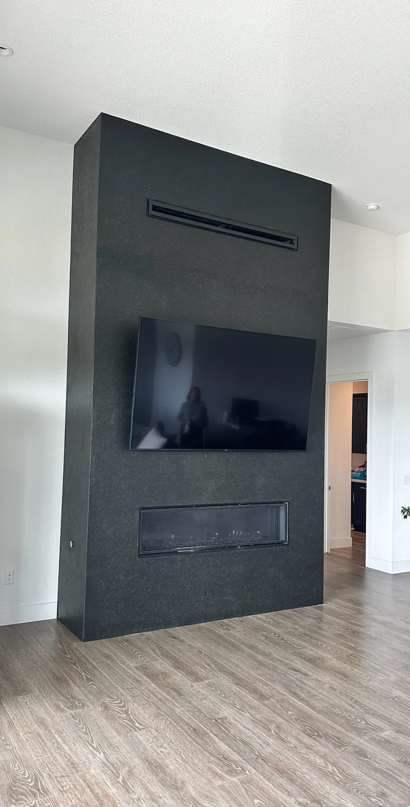 Flamed Absolute Black granite fireplace surround with mitered side returns in a Genoa, Nevada home